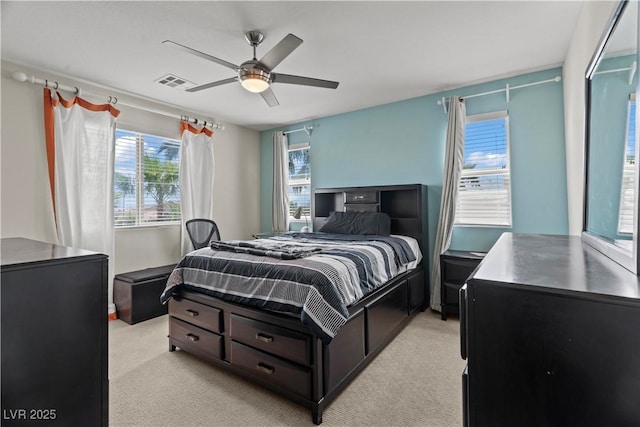 1776 Gentle Brook St, North Las Vegas, NV 89084 - bedroom featuring light colored carpet, multiple windows, and visible vents