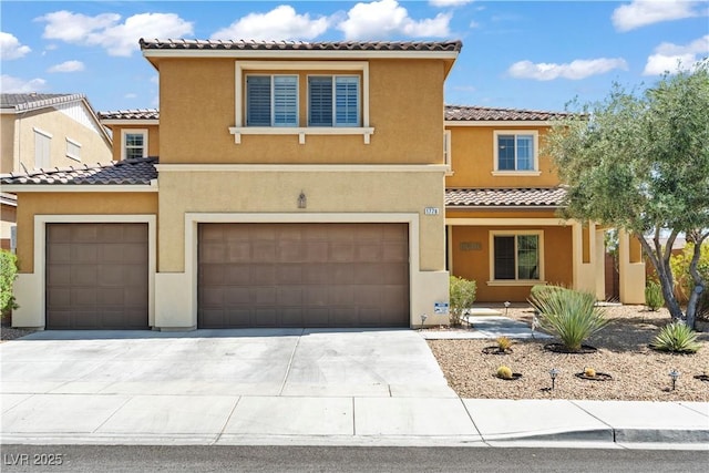 1776 Gentle Brook St, North Las Vegas, NV 89084 - view of front of house featuring concrete driveway, a tile roof, a garage, and stucco siding