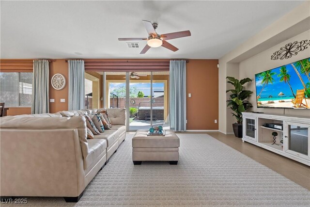 1776 Gentle Brook St, North Las Vegas, NV 89084 - living room with baseboards, a ceiling fan, and visible vents