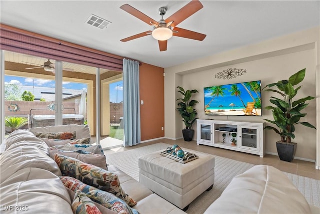 1776 Gentle Brook St, North Las Vegas, NV 89084 - tiled living room with visible vents, baseboards, and a ceiling fan