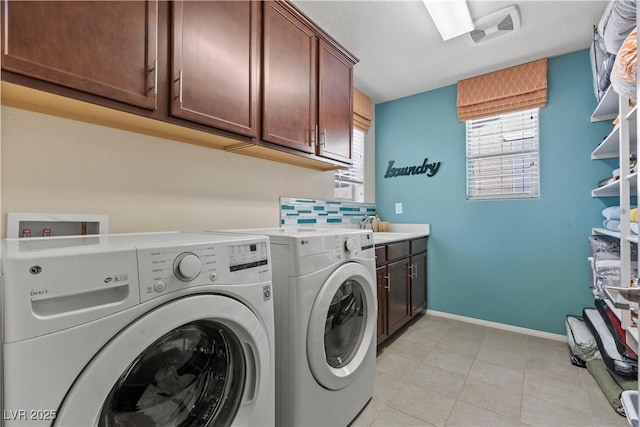 1776 Gentle Brook St, North Las Vegas, NV 89084 - clothes washing area with baseboards, light tile patterned floors, visible vents, cabinet space, and washer and dryer