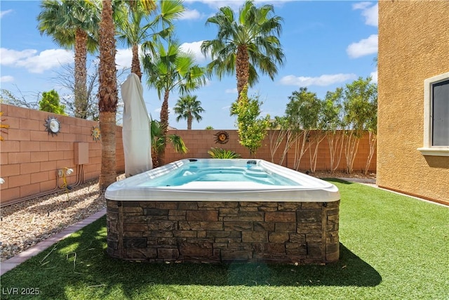 1776 Gentle Brook St, North Las Vegas, NV 89084 - view of swimming pool with a fenced backyard, a hot tub, and a lawn