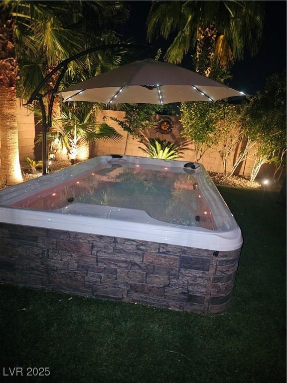 1776 Gentle Brook St, North Las Vegas, NV 89084 - exterior space featuring a jacuzzi and a fenced backyard