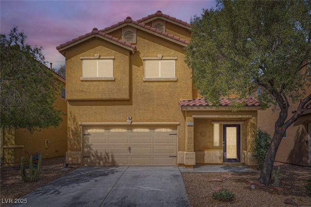 9651 Bouncing Ball St, Las Vegas, NV 89178 - view of front of property with an attached garage, a tile roof, concrete driveway, and stucco siding