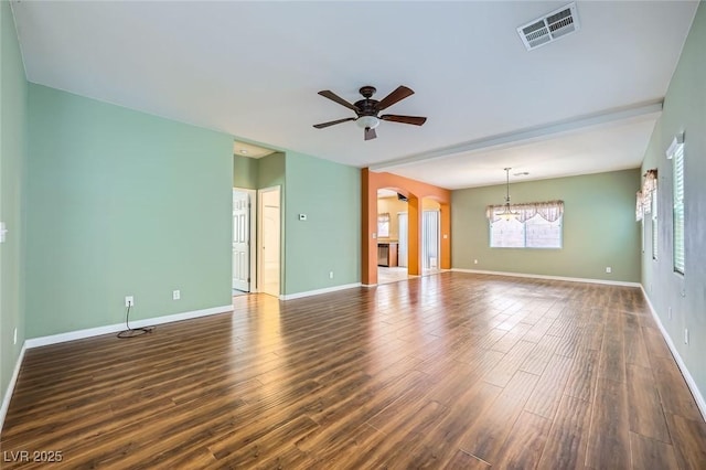9651 Bouncing Ball St, Las Vegas, NV 89178 - unfurnished living room featuring a chandelier, ceiling fan, arched walkways, wood finished floors, and baseboards