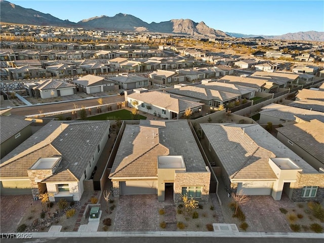 aerial view featuring a mountain view and a residential view