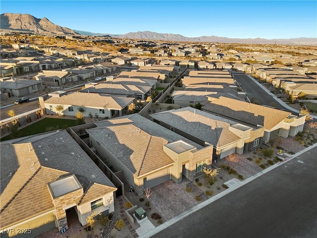 drone / aerial view with a mountain view and a residential view