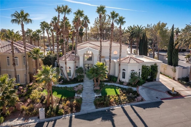 8109 Moonstone Cir, Las Vegas, NV 89128 - mediterranean / spanish house featuring a tiled roof and stucco siding
