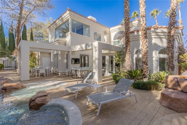 8109 Moonstone Cir, Las Vegas, NV 89128 - rear view of property featuring outdoor dining space, a tile roof, a patio area, and stucco siding
