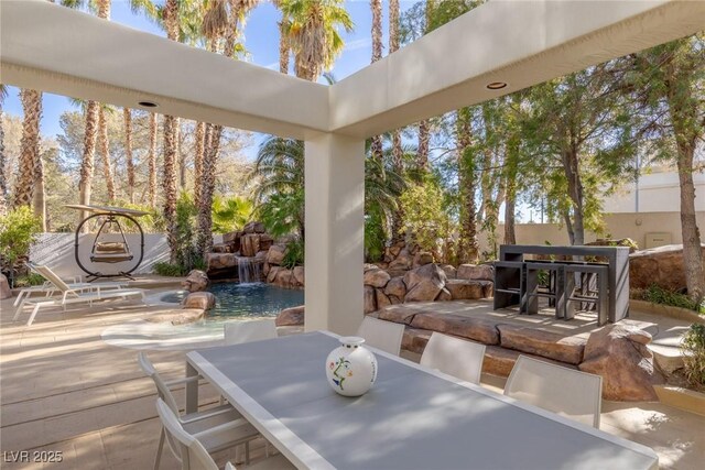 8109 Moonstone Cir, Las Vegas, NV 89128 - view of patio / terrace with outdoor dining area and an outdoor pool