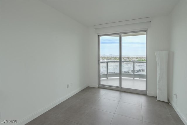 222 Karen Ave Unit 708, Las Vegas, NV 89109 - empty room featuring baseboards and tile patterned flooring