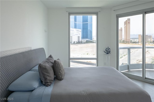 222 Karen Ave Unit 708, Las Vegas, NV 89109 - bedroom with access to outside and tile patterned floors
