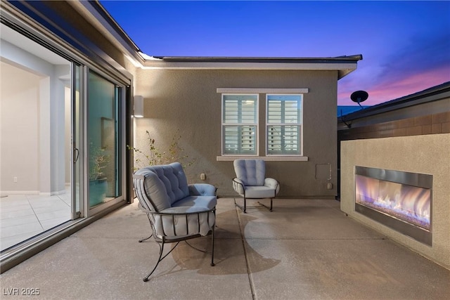 18 Via Tiberina, Henderson, NV 89011 - view of patio / terrace featuring a glass covered fireplace