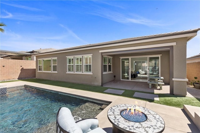 18 Via Tiberina, Henderson, NV 89011 - rear view of property featuring a patio area, an outdoor fire pit, fence, and stucco siding