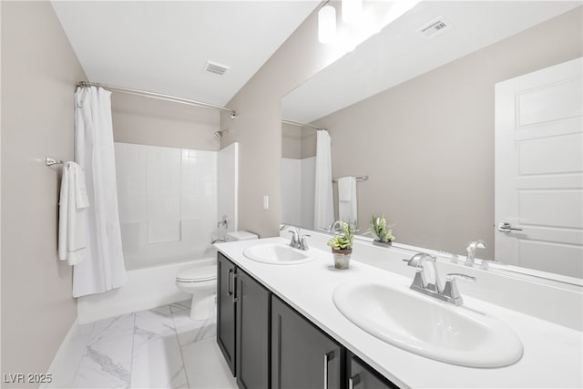 bathroom with toilet, a sink, and visible vents