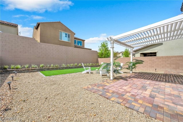 view of patio with a pergola and fence