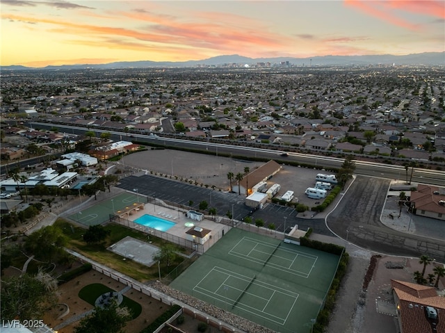 6861 E Washington Ave, Las Vegas, NV 89110 - aerial view at dusk of a mountain view and view of pool area