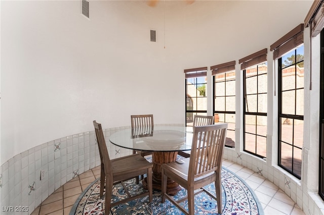 6861 E Washington Ave, Las Vegas, NV 89110 - dining space with light tile patterned floors and plenty of natural light