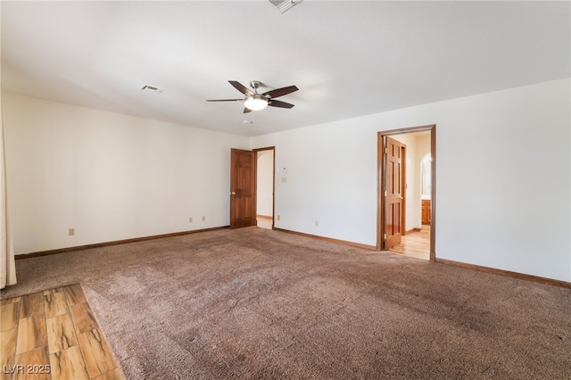 6861 E Washington Ave, Las Vegas, NV 89110 - empty room with a ceiling fan, light colored carpet, baseboards, and light wood-style floors