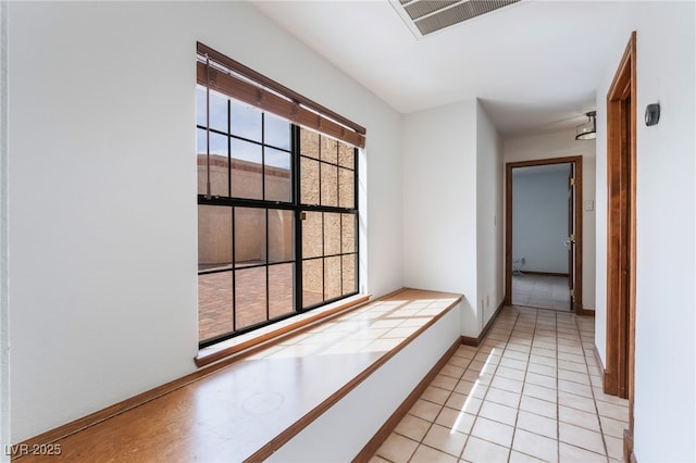 6861 E Washington Ave, Las Vegas, NV 89110 - corridor featuring light tile patterned flooring and baseboards