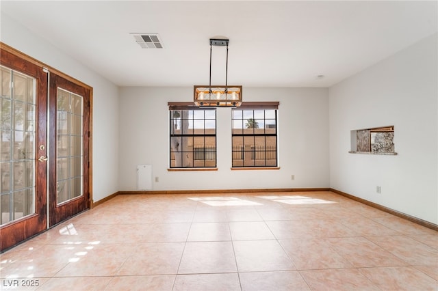 6861 E Washington Ave, Las Vegas, NV 89110 - empty room with french doors, light tile patterned floors, and baseboards