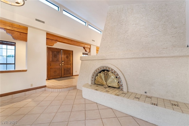 6861 E Washington Ave, Las Vegas, NV 89110 - unfurnished living room with tile patterned flooring and baseboards