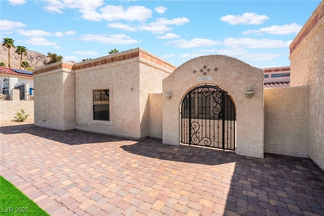 6861 E Washington Ave, Las Vegas, NV 89110 - entrance to property with stucco siding, a gate, and fence