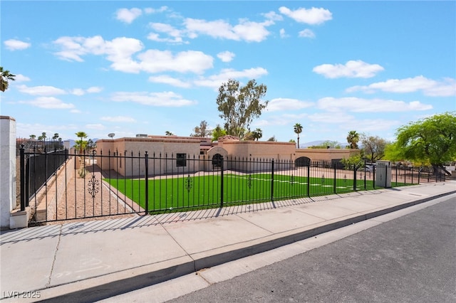 6861 E Washington Ave, Las Vegas, NV 89110 - view of front of home with stucco siding and a gate