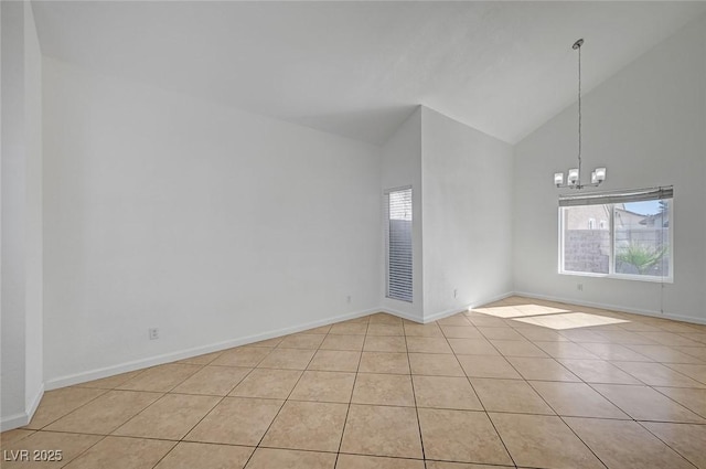 unfurnished room with light tile patterned floors, baseboards, high vaulted ceiling, and an inviting chandelier