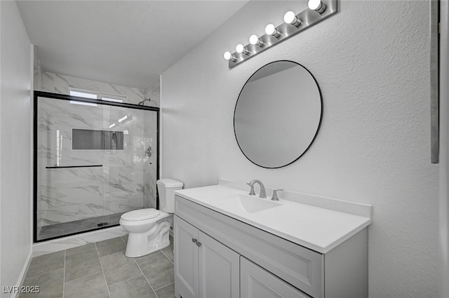 bathroom with toilet, vanity, and a marble finish shower