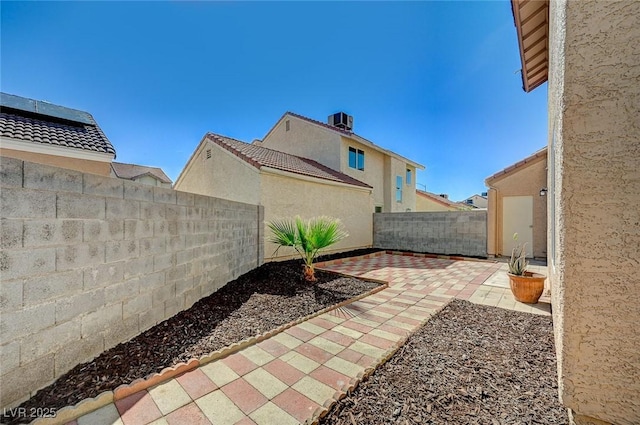 view of patio / terrace with a fenced backyard and cooling unit