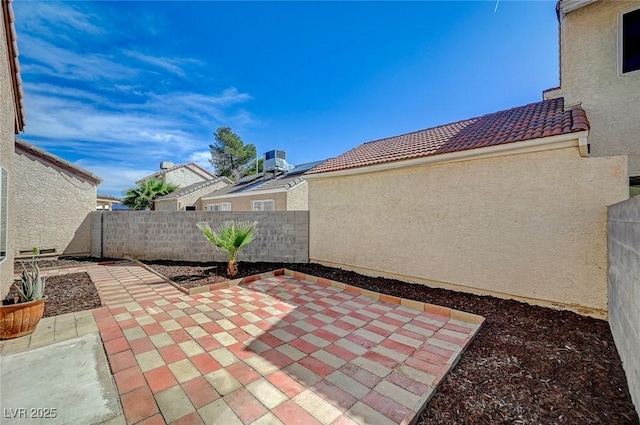 view of patio with a fenced backyard and cooling unit