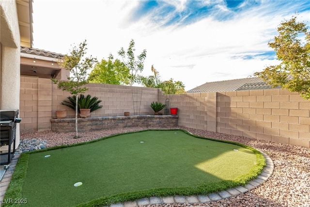 7386 Campbell Ranch Ave, Las Vegas, NV 89179 - fenced backyard featuring an area to practice putting