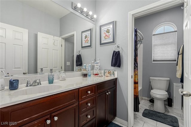 bathroom with a shower with shower curtain, baseboards, toilet, vanity, and marble finish floor