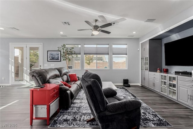 living area with recessed lighting, ceiling fan, visible vents, baseboards, and dark wood finished floors