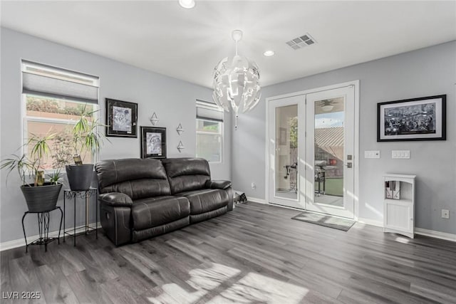living area with recessed lighting, a chandelier, visible vents, baseboards, and wood finished floors