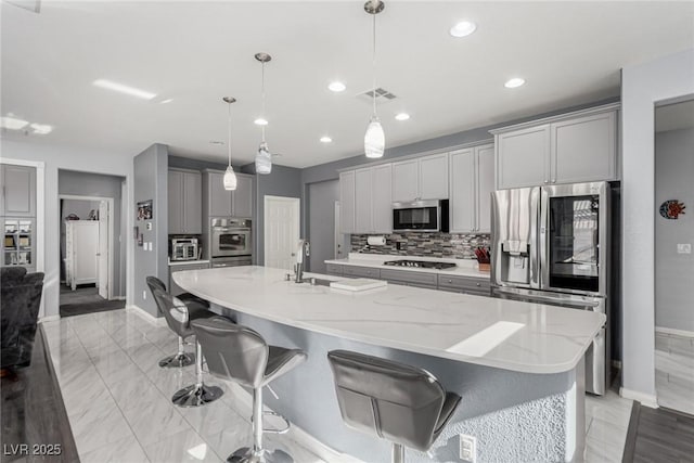 kitchen with decorative backsplash, visible vents, stainless steel appliances, baseboards, and recessed lighting