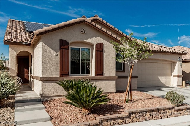 7386 Campbell Ranch Ave, Las Vegas, NV 89179 - mediterranean / spanish-style house with a garage, roof mounted solar panels, a tile roof, driveway, and stucco siding