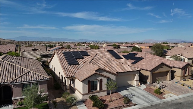 drone / aerial view with a mountain view and a residential view