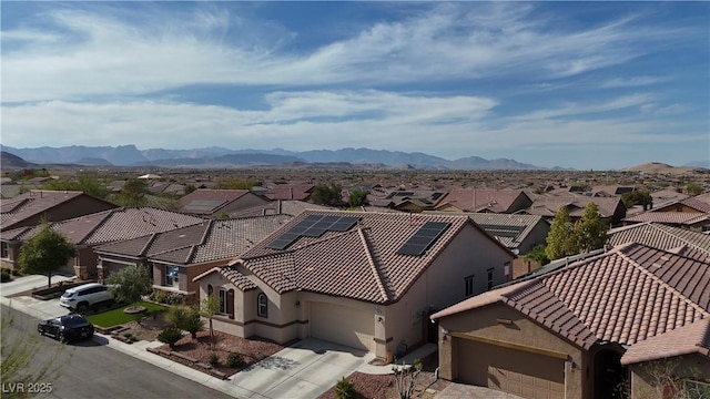birds eye view of property with a mountain view and a residential view