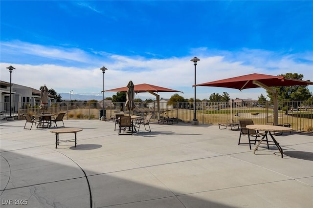 surrounding community featuring a patio area and fence