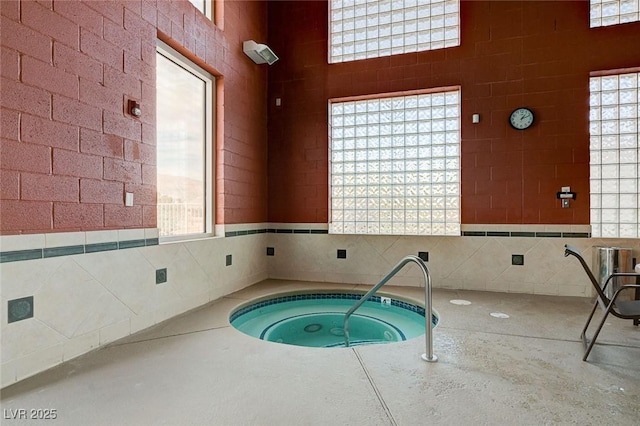 view of pool featuring an indoor hot tub