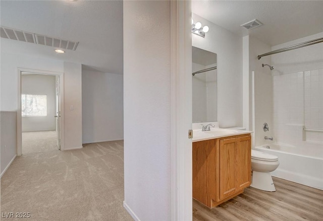 full bath with toilet, vanity, and tub / shower combination