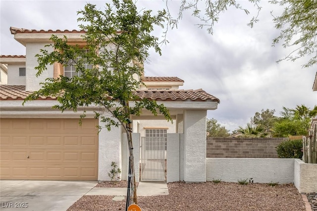 8005 Exploration Ave, Las Vegas, NV 89131 - mediterranean / spanish-style home featuring stucco siding, fence, driveway, a tile roof, and a gate