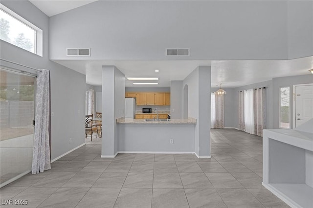 8005 Exploration Ave, Las Vegas, NV 89131 - interior space with a towering ceiling, baseboards, and visible vents