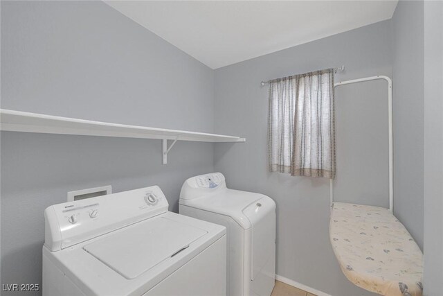 8005 Exploration Ave, Las Vegas, NV 89131 - laundry room featuring baseboards, washer and clothes dryer, and laundry area