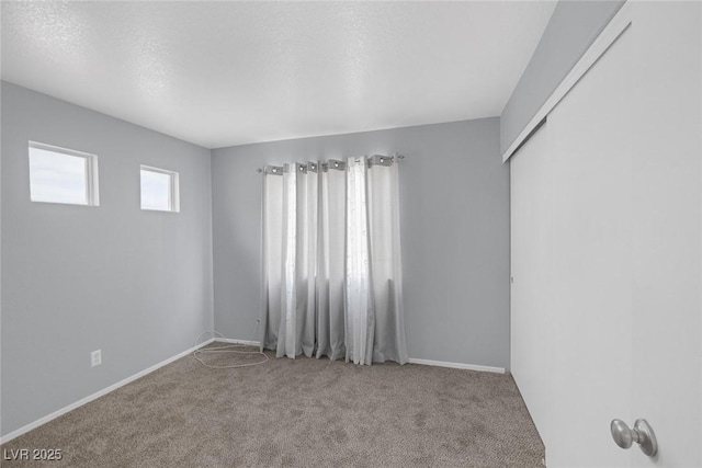 8005 Exploration Ave, Las Vegas, NV 89131 - spare room with baseboards and carpet