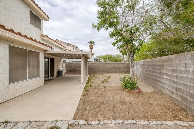 8005 Exploration Ave, Las Vegas, NV 89131 - view of yard featuring a patio area and a fenced backyard
