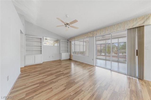 unfurnished living room featuring plenty of natural light, lofted ceiling, a ceiling fan, and light wood-style floors