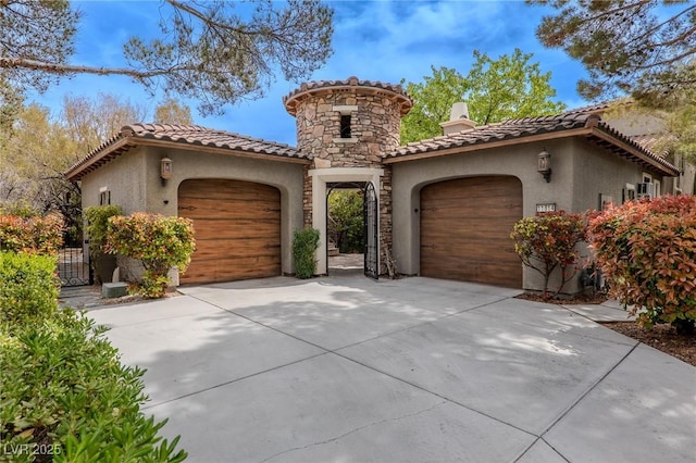 11814 Canons Brook Dr, Las Vegas, NV 89141 - mediterranean / spanish-style home with an attached garage, concrete driveway, stucco siding, and a tile roof